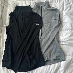 Two Nike Drifit - lightly fleece lined long sleeves. Women’s size Medium.